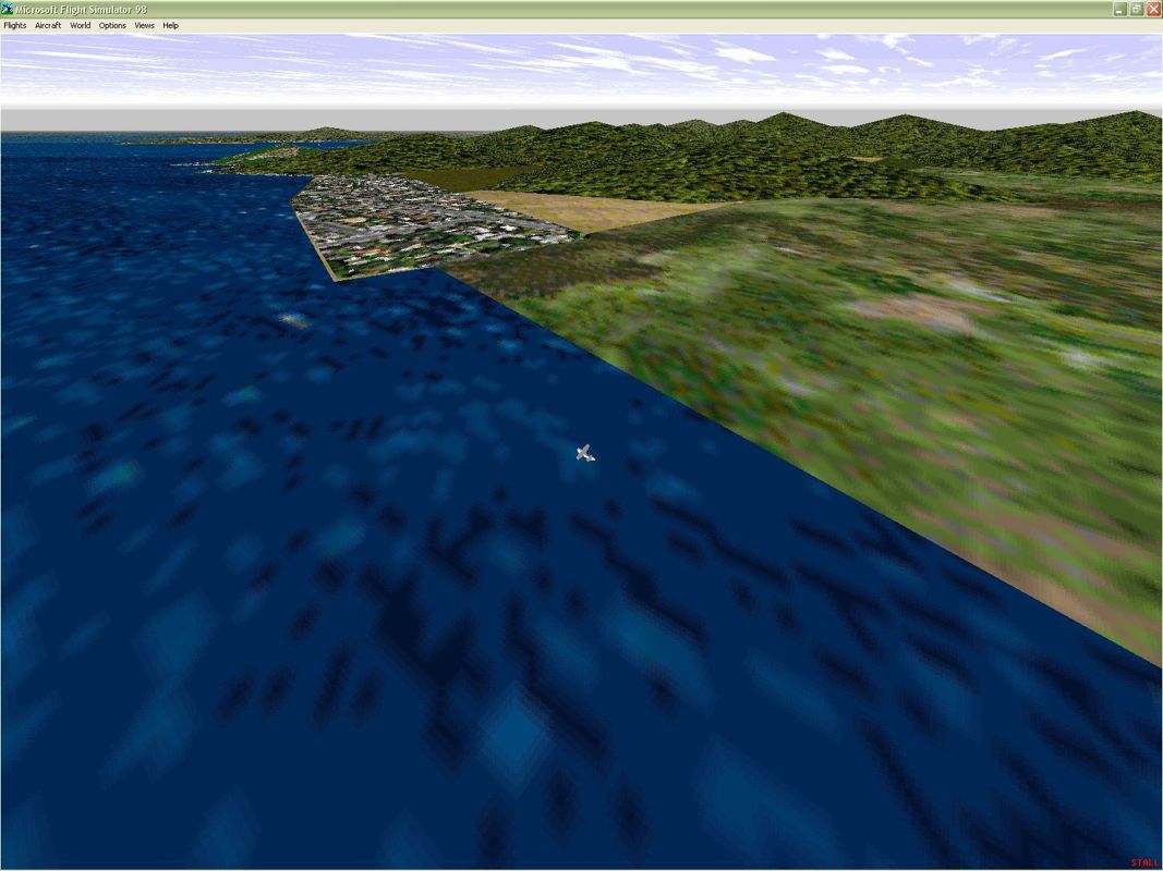 747 (Windows) screenshot: The French Riviera using the new Nice/Cannes scenery. The inhabited areas extend into the cove behind the plane and well into the distance. Microsoft Flight Simulator 98