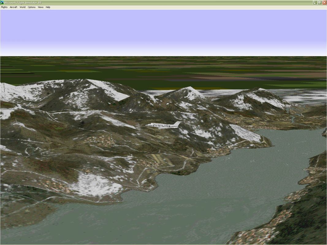 Venezia 98 (Windows) screenshot: These are the mountains near Verona Boscomantico airport in the winter. To change the season the new scenery file must be loaded. Microsoft Flight Simulator 98