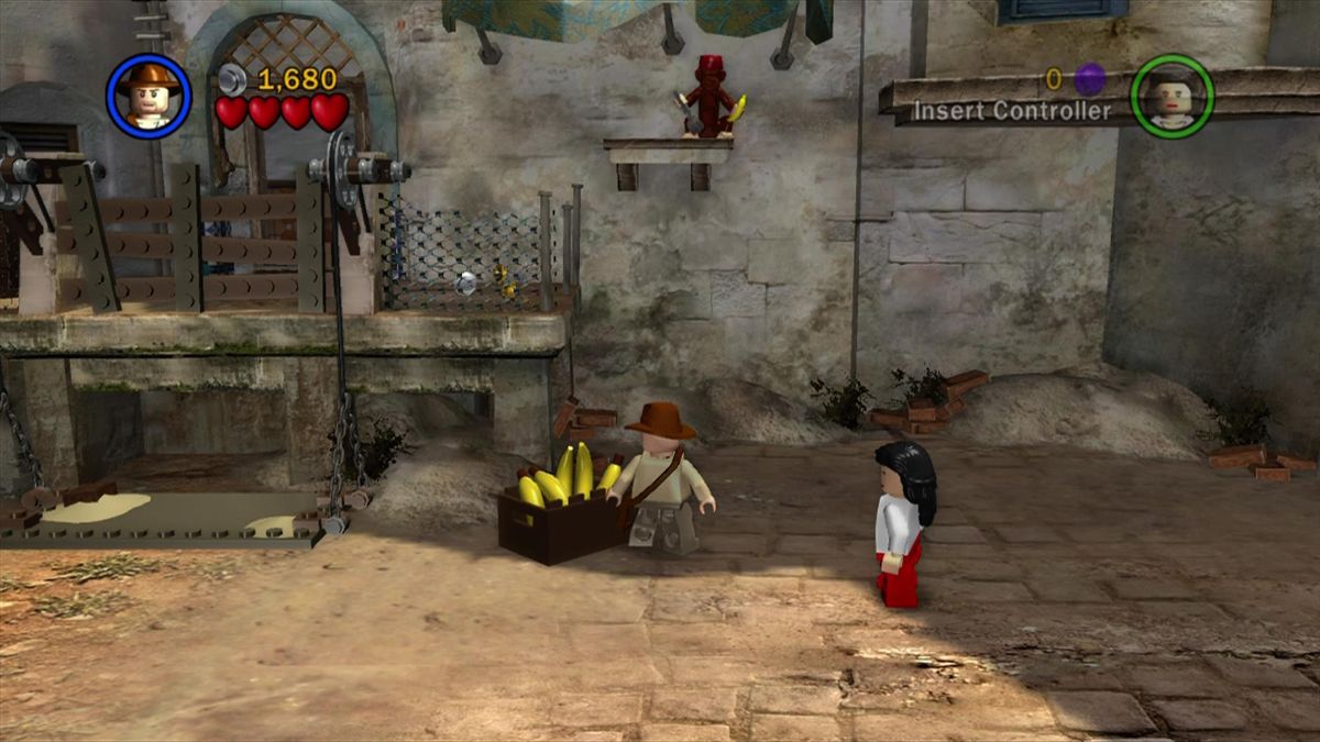 LEGO Indiana Jones: The Original Adventures (Xbox 360) screenshot: Throw the monkey a banana to receive an item