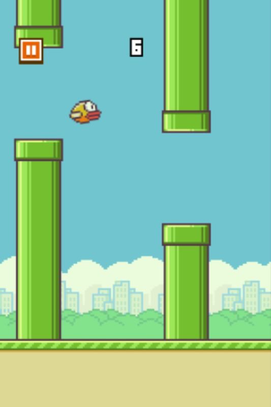 Flappy Bird (iPhone) screenshot: Navigating through pipes
