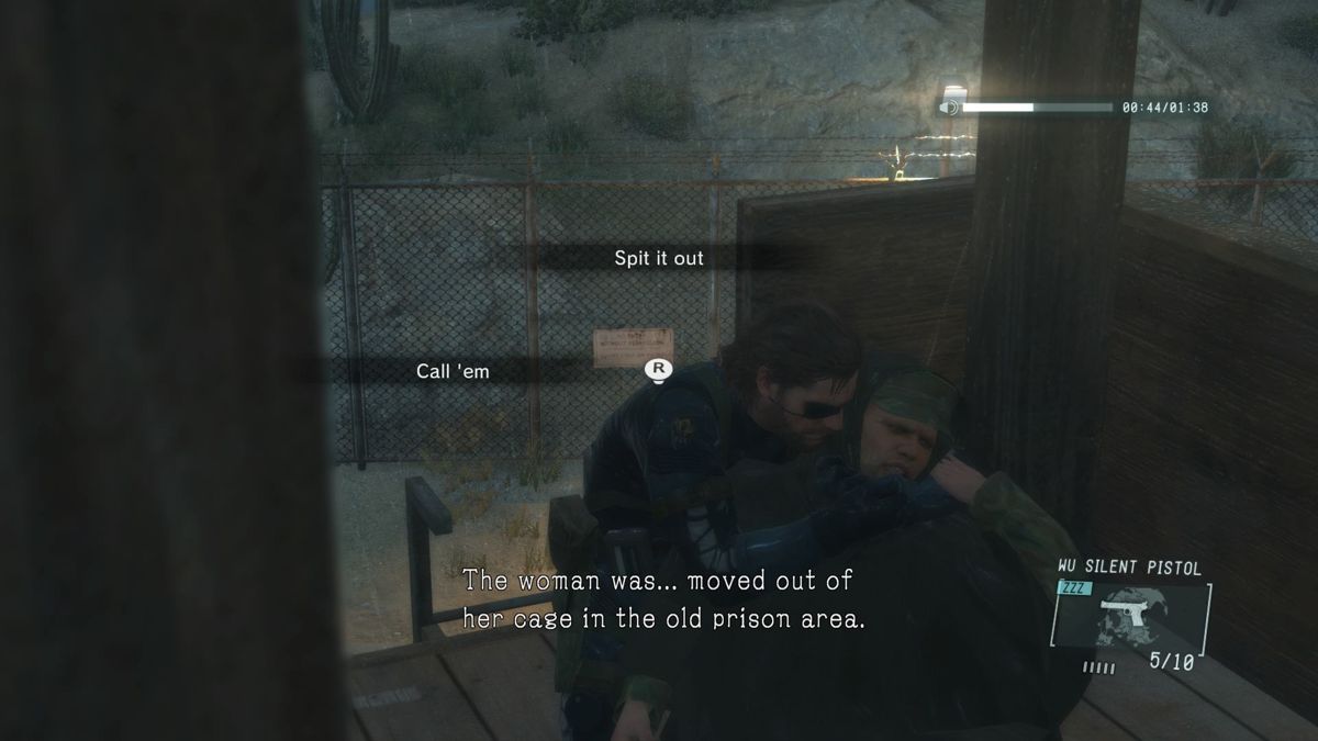 Metal Gear Solid V: Ground Zeroes (PlayStation 4) screenshot: Interrogating an enemy guard.