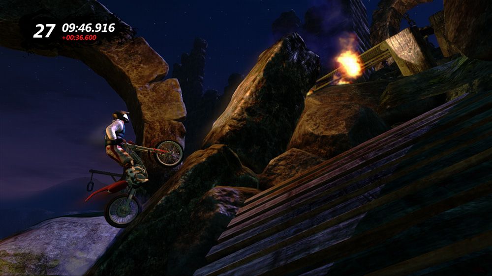 Trials Evolution (Xbox 360) screenshot: Going up a rock on a night track.