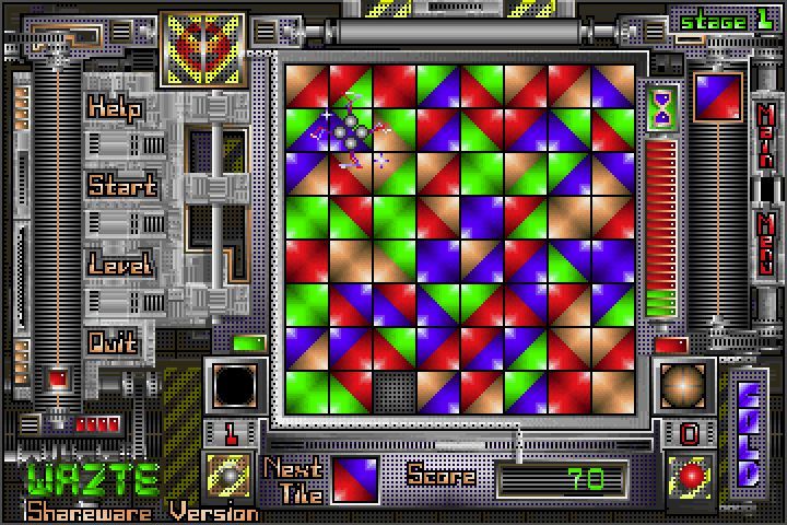 Wazte (DOS) screenshot: The single shot in the left turret has been used. It will clear five tiles in a cross shape. It's getting to work in the upper left of the game area
