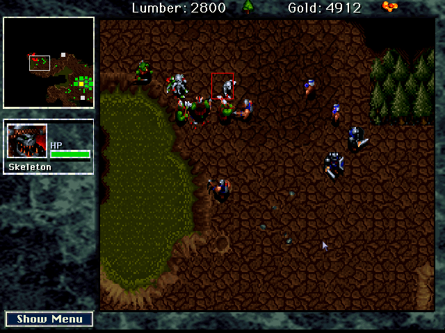 WarCraft: Orcs & Humans (Macintosh) screenshot: The Orcs bolster their forces with skeletons to repel a human attack.