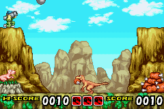 Jurassic Park Institute Tour: Dinosaur Rescue (Game Boy Advance) screenshot: Returning with a big bite of tasty meat for the baby.