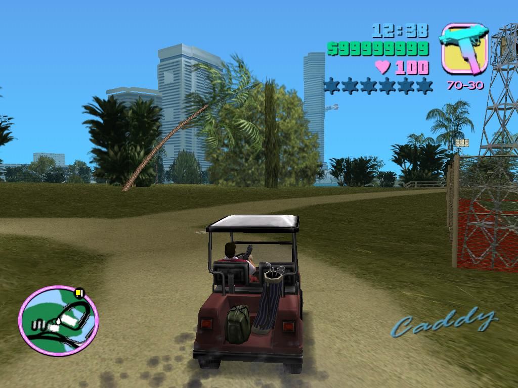 Grand Theft Auto: Vice City (Windows) screenshot: There's just something appealing about driving a golf cart, with an uzi, while wearing plaid golf clothes.