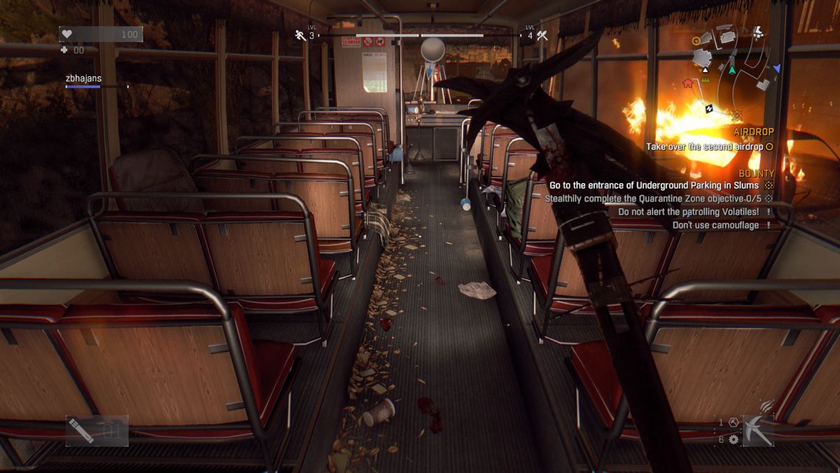 Dying Light: The Following - Enhanced Edition (PlayStation 4) screenshot: Dying Light: Searching one of the busses for useful items