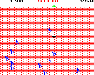 Siege (BBC Micro) screenshot: Dropping a rock on the incoming soldiers.