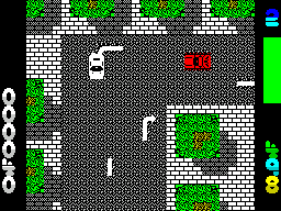 Miami Chase (ZX Spectrum) screenshot: I'm the good guy in a white car. The green bar on the right is the health of the car, looking good right now. There's also a countdown timer that starts at 500