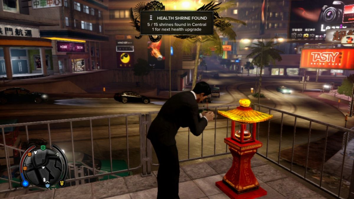 Sleeping Dogs (PlayStation 3) screenshot: Pray at shrines around the town to increase your maximum health.