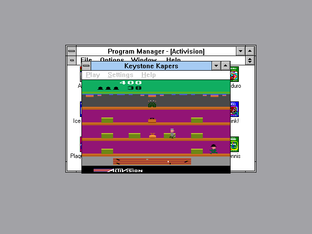 Activision's Atari 2600 Action Pack 2 (Windows 3.x) screenshot: Playing Keystone Kapers in a window. Chase after the criminal and catch him!