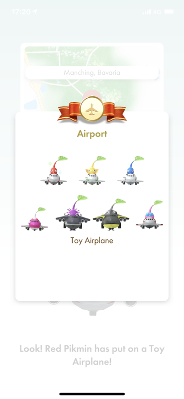 Pikmin Bloom (iPhone) screenshot: A red Pikmin has put on a toy airplane, my airport decor collection is now complete.