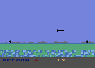 Computer War (Atari 8-bit) screenshot: Trying to shoot a missile near the coast.