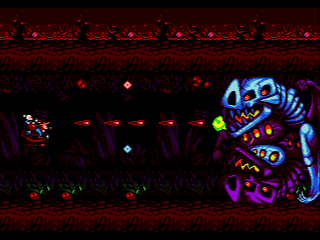Fatal Smarties (Genesis) screenshot: A large enemy that returns several times, but with different shooting patterns.