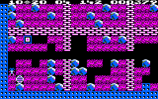 Boulder Dash (Amstrad CPC) screenshot: Collect the diamond, and watch out for that deadly box!