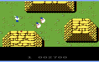 Ikari Warriors II: Victory Road (Commodore 64) screenshot: Make your way around some obstacles...