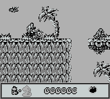 Chuck Rock (Game Boy) screenshot: somethings hiding in the tree