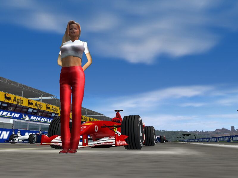 F1 2002 (Windows) screenshot: Grid girl 2