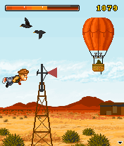 Johnny Crash Stuntman Does Texas (BREW) screenshot: Johnny flies past several targets