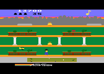 Keystone Kapers (Atari 8-bit) screenshot: Be sure to duck this incoming plane!
