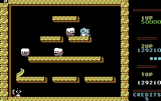 Bubble Bobble (Commodore 64) screenshot: Blow a bubble to destroy this bad guy!