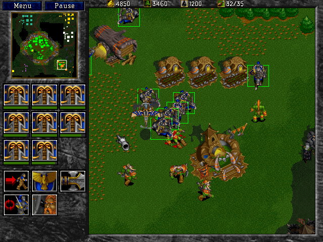 WarCraft II: Battle Chest (Windows) screenshot: Knights attack an Orcish Base