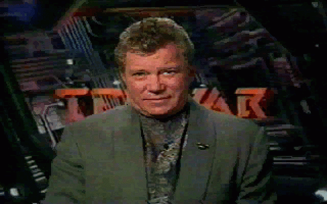 William Shatner's TekWar (DOS) screenshot: Shatner during a mission briefing (not that they are very useful).