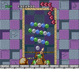 Bust-A-Move (SNES) screenshot: Clear all the bubbles to pass the level.