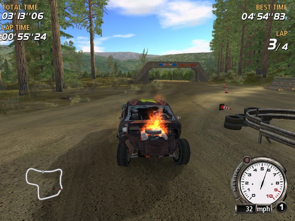 FlatOut (Windows) screenshot: Damage is great (body parts deform and fall off). Eventually car starts burning
