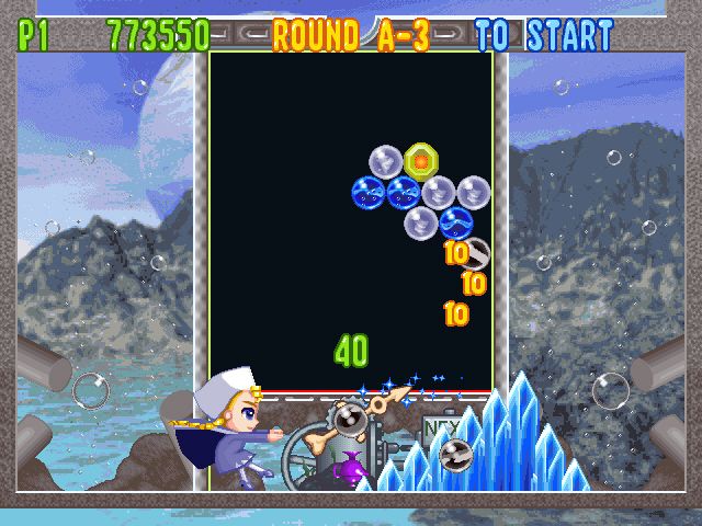 Bust-A-Move 4 (Windows) screenshot: Good shots are rewarded with animations (this almost looks like Streetfighter ;-> )
