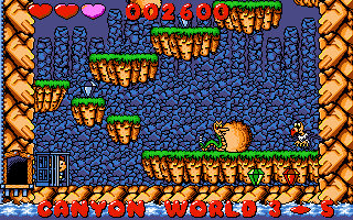 Dino Jnr. in Canyon Capers (DOS) screenshot: Avoid rolling rocks in the canyon (VGA)