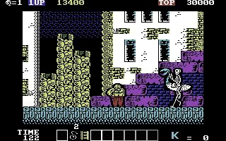 Karnov (Commodore 64) screenshot: Watch out for this skeleton type guy