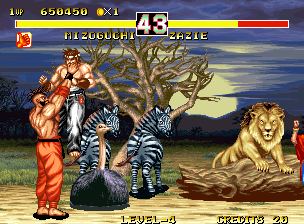 Fighter's History Dynamite (Neo Geo) screenshot: Zazie holds Mizuguchi up in the air