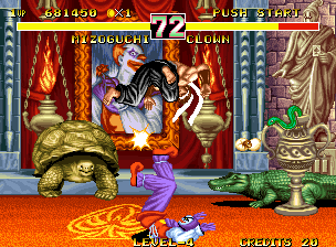 Fighter's History Dynamite (Neo Geo) screenshot: Clown jiggles Mizuguchi using his feet