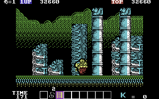 Karnov (Commodore 64) screenshot: Be careful of the poison dart shooting totem poles!