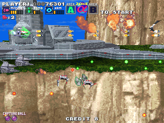G Darius (Arcade) screenshot: Bombs are useful to kill low-flying enemy