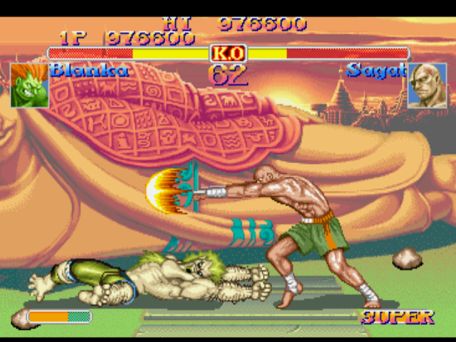 Street Fighter Collection (PlayStation) screenshot: Blanka avoids Sagat's Tiger Shot with the success of his avoid-attacking move Amazon River Run.
