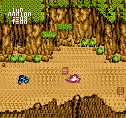 BreakThru (NES) screenshot: Shooting some crates.