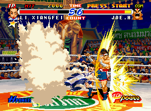 Real Bout Fatal Fury 2: The Newcomers (Neo Geo CD) screenshot: In a certain moment, Joe is suddenly struck by the shoulder-stomping hit of Xiangfei's Chou Pairon.