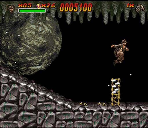 Indiana Jones' Greatest Adventures (SNES) screenshot: Indy chased by a giant rock