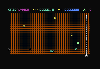 Gridrunner (Commodore 64) screenshot: You don't have to stay on the bottom. Sometime moving will help you escape the left-side gun. Here the ship has moved away from the bottom, into the grid toward the pod-chain.