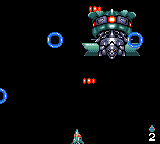 GG Aleste (Game Gear) screenshot: Behind the cannon is an ugly head!