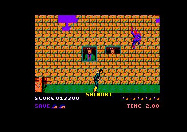 Shinobi (Amstrad CPC) screenshot: A ninja clings to the wall