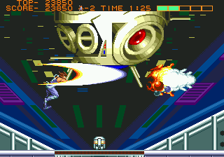 Strider (Genesis) screenshot: This is a weird anti-gravity challenge where Hiryu spins around this mechanical core whilst destroying it.