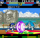 SNK vs. Capcom: The Match of the Millennium (Neo Geo Pocket Color) screenshot: By Sakura's hands, a Shinkuu Hadou-Ken directs to a knocked-down recovered Felicia.