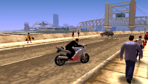 Grand Theft Auto: Liberty City Stories (PSP) screenshot: On a bike on Staunton Island, looking over at Shoreside Vale and Francis International Airport.