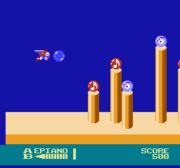 Otocky (NES) screenshot: Shoot out the blue orb to collect the musical notes