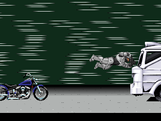 RoboCop 2 (Arcade) screenshot: RoboCop is jumping into the truck cockpit. Heck, he's half machine, he doesn't care