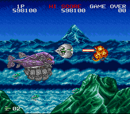 Darius Twin (SNES) screenshot: Avoid the attack from behind...