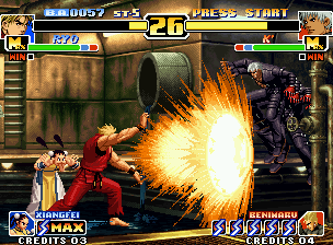 The King of Fighters '99: Millennium Battle (Neo Geo) screenshot: Ryo (helped by Xiangfei) attacks K' with his SDM Haou Shou Ko Ken, but he escapes using a high jump.
